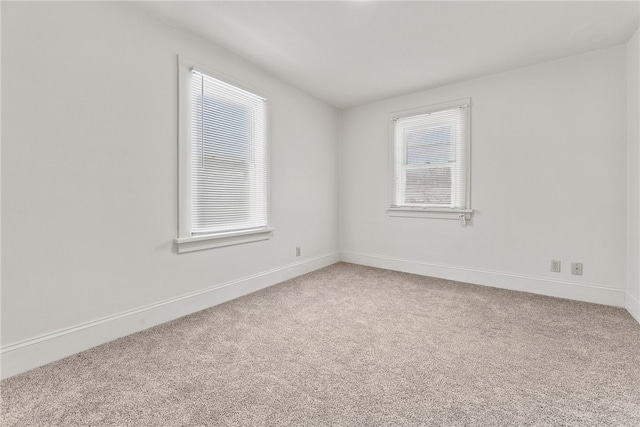 spare room featuring carpet floors