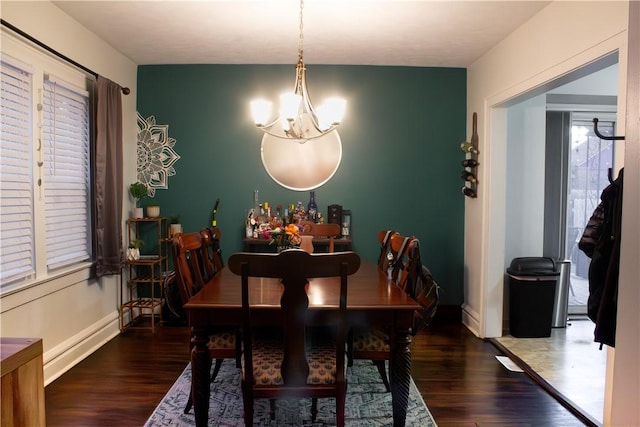 dining room with dark hardwood / wood-style floors