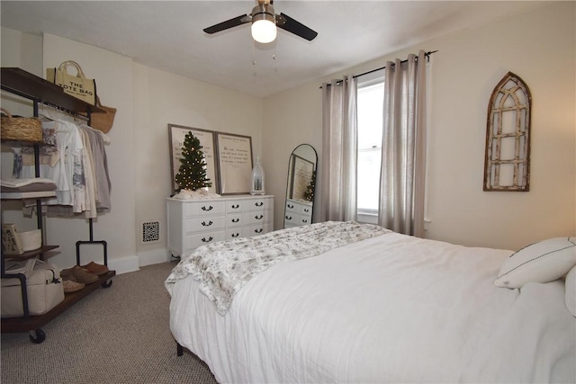 bedroom with ceiling fan and light colored carpet