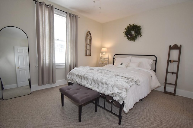 bedroom with light colored carpet