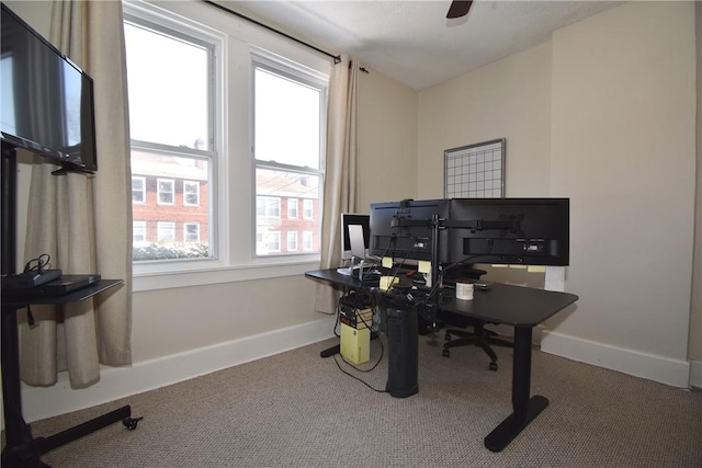 office with carpet flooring and a wealth of natural light