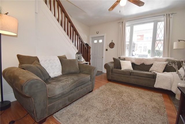 living room featuring ceiling fan and wood-type flooring