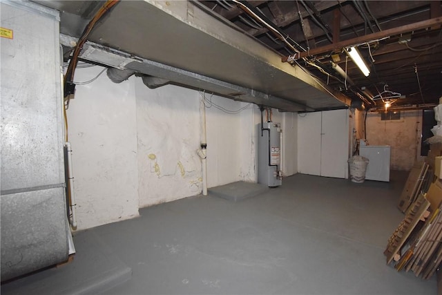 basement with fridge and gas water heater