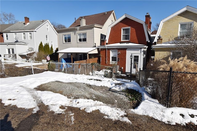 view of snow covered house