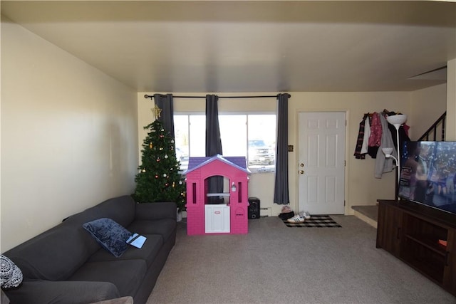 playroom with baseboard heating and carpet floors