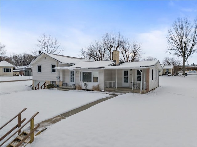 view of snow covered house