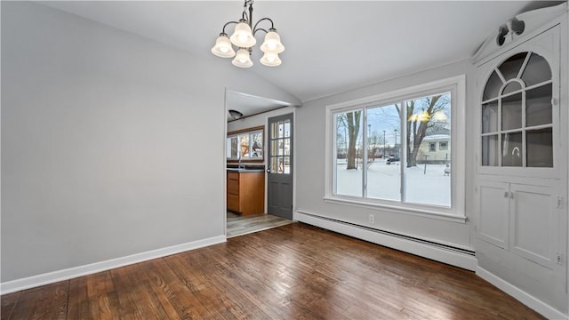 unfurnished dining area with hardwood / wood-style flooring, a notable chandelier, a wealth of natural light, and a baseboard radiator