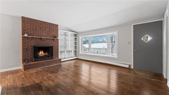 unfurnished living room featuring a brick fireplace, dark hardwood / wood-style floors, lofted ceiling, and a baseboard heating unit