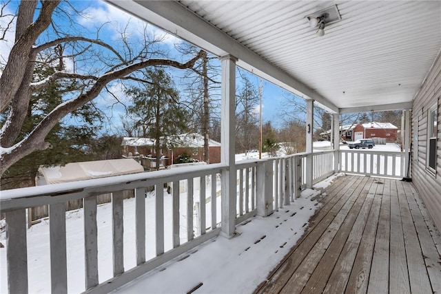 view of snow covered deck