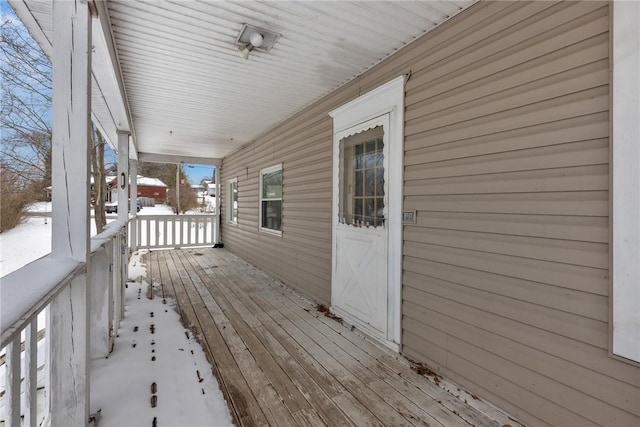 view of snow covered deck