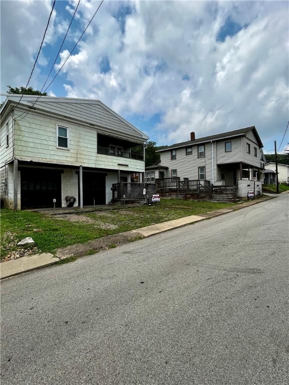 view of side of property with a garage