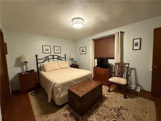 bedroom featuring hardwood / wood-style flooring