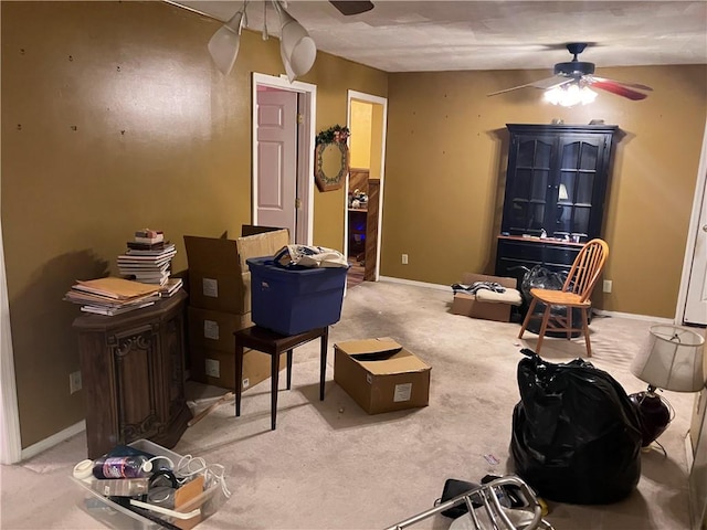 interior space featuring carpet flooring and ceiling fan