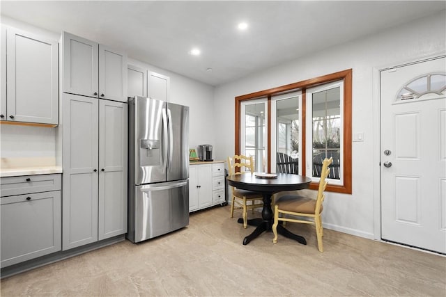 kitchen featuring gray cabinetry and stainless steel fridge