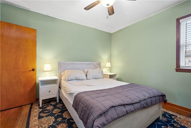 bedroom featuring ceiling fan and hardwood / wood-style flooring