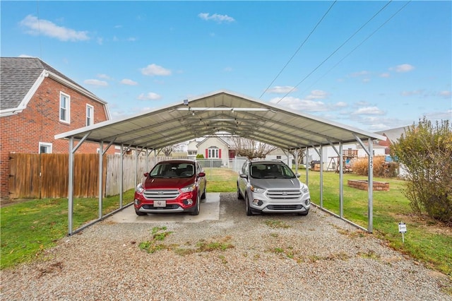 view of parking with a yard and a carport