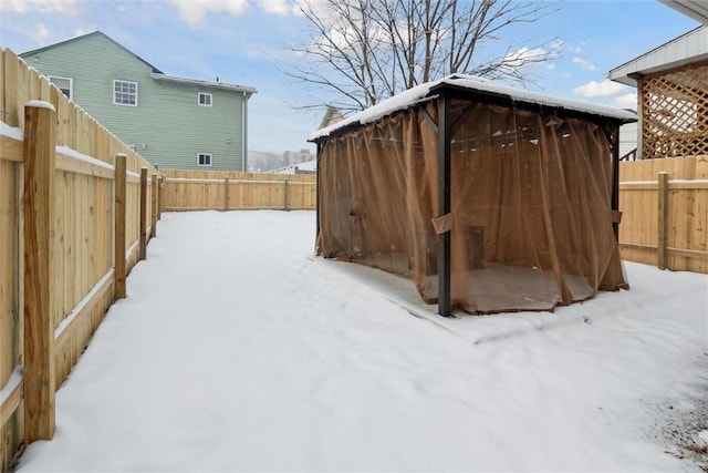 view of yard covered in snow