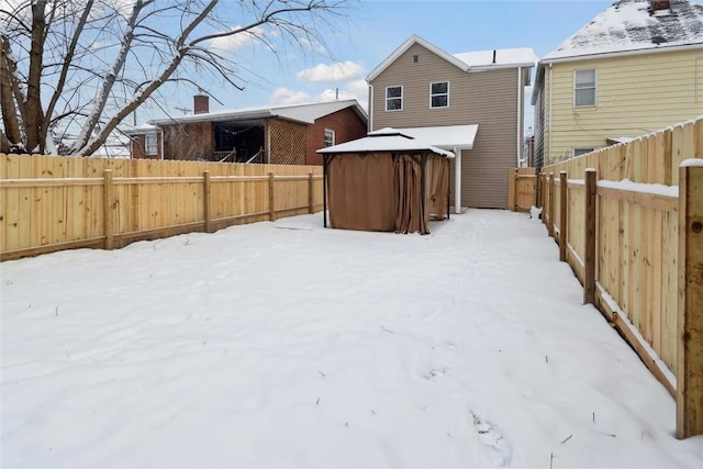 view of yard layered in snow