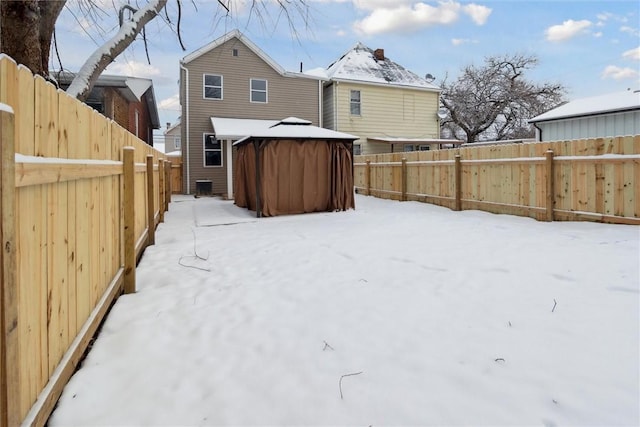 yard layered in snow featuring a gazebo