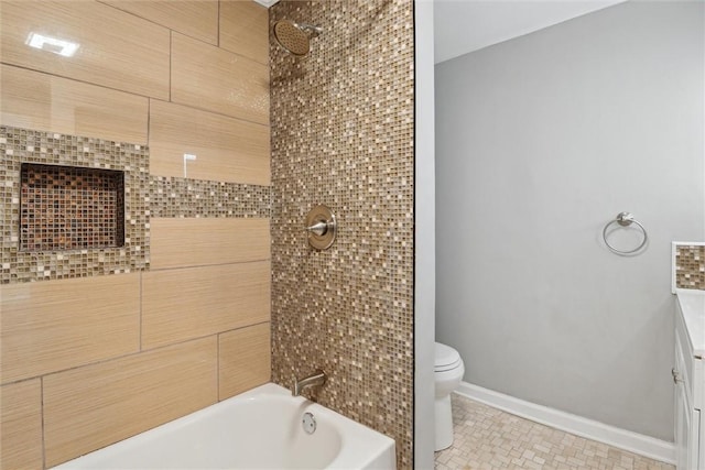 bathroom with toilet, tile patterned flooring, and tiled shower / bath