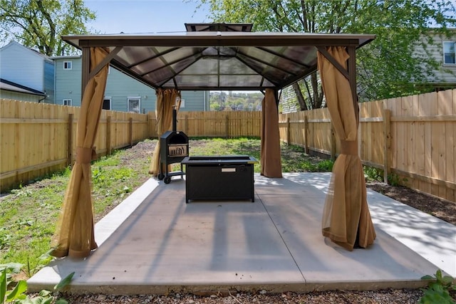 view of patio featuring a gazebo and a fenced backyard