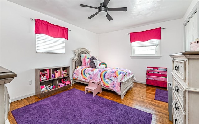 bedroom with ceiling fan and wood-type flooring