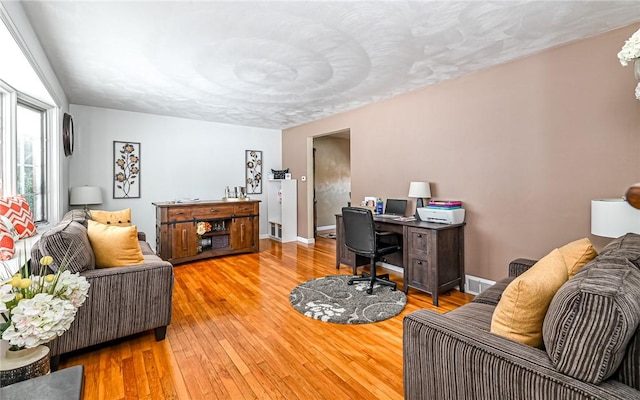 home office featuring hardwood / wood-style floors