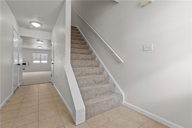 stairway with tile patterned flooring