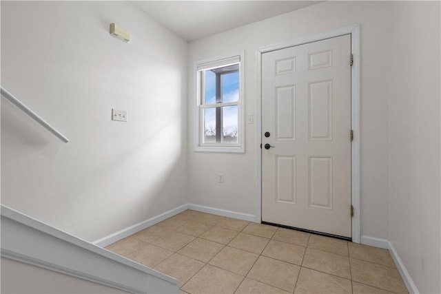 foyer entrance with light tile patterned floors