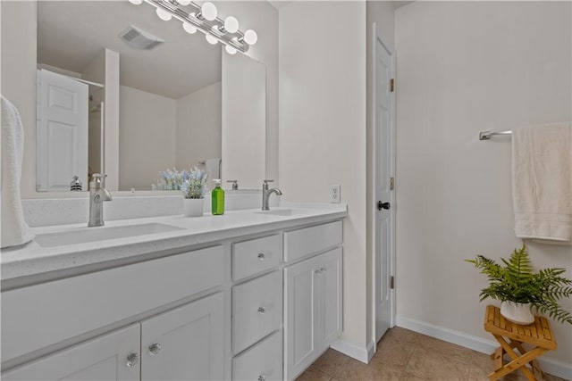 bathroom featuring tile patterned floors and vanity