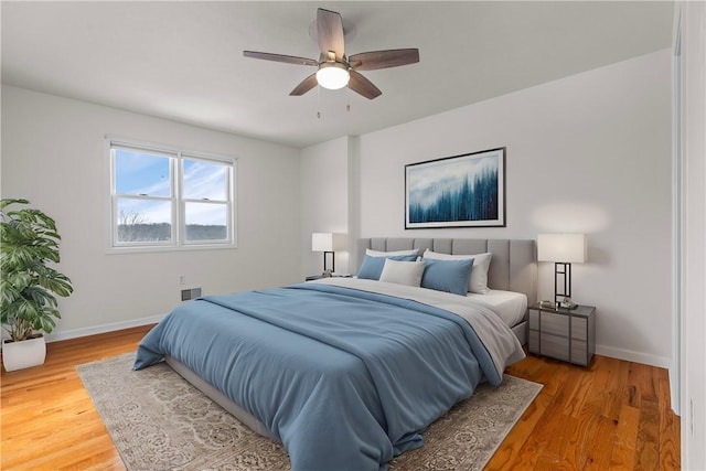 bedroom featuring ceiling fan and wood-type flooring