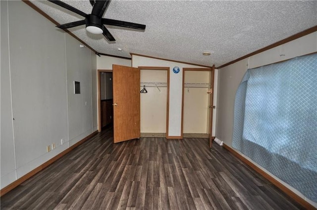 interior space with a textured ceiling, ceiling fan, crown molding, and vaulted ceiling