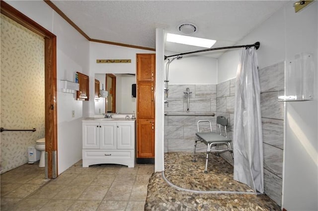 bathroom with vanity, lofted ceiling, crown molding, toilet, and walk in shower