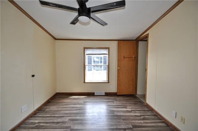 spare room with ceiling fan, dark hardwood / wood-style floors, and ornamental molding