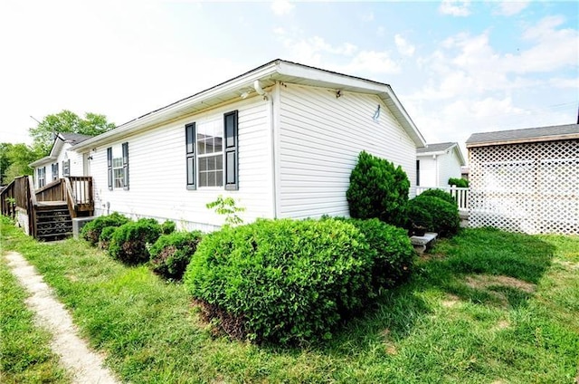 view of property exterior featuring a yard