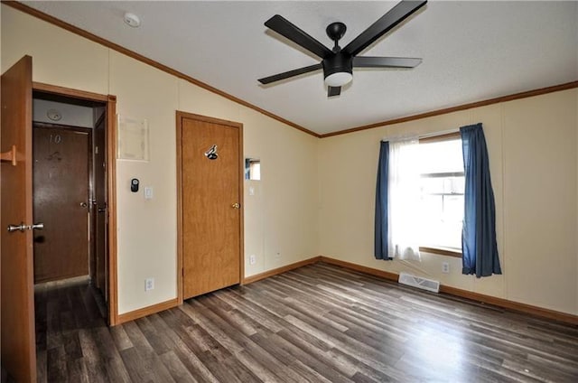 unfurnished room featuring ornamental molding, dark hardwood / wood-style flooring, ceiling fan, and lofted ceiling