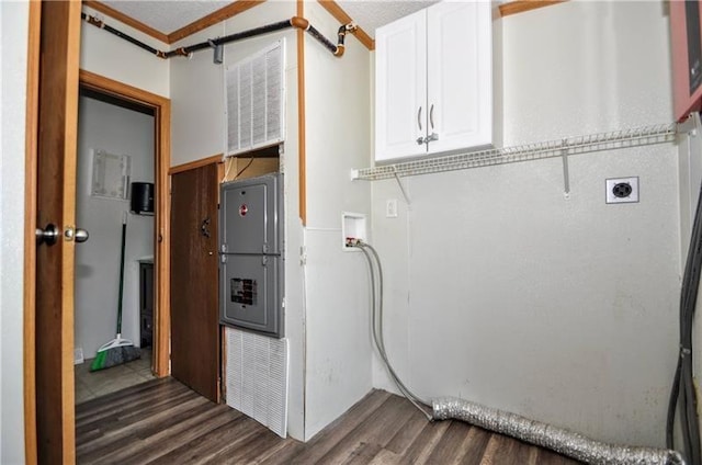 laundry room featuring hookup for an electric dryer, dark hardwood / wood-style flooring, cabinets, and washer hookup