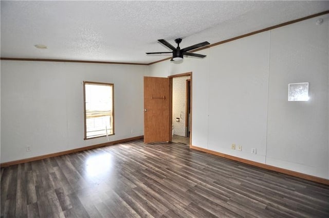 empty room featuring dark hardwood / wood-style floors, ceiling fan, and crown molding