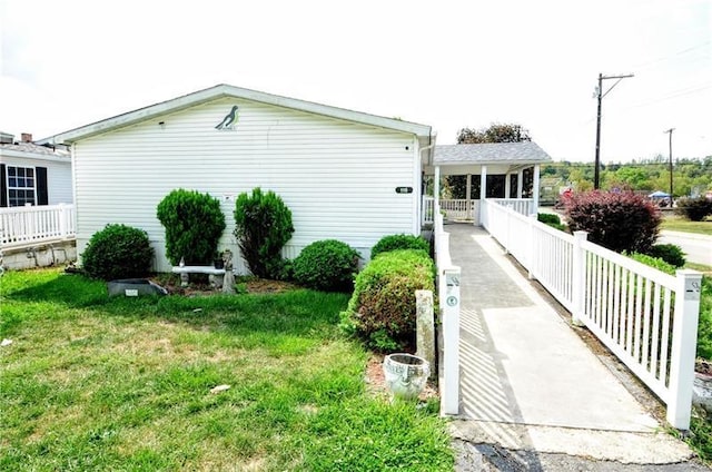 view of property exterior with a yard