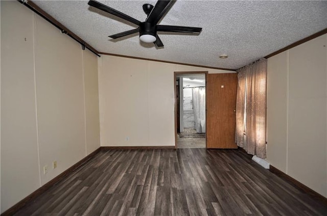 empty room with a textured ceiling, ceiling fan, and crown molding