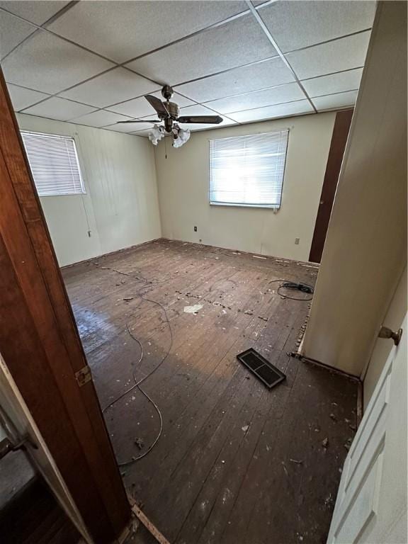 unfurnished room with a paneled ceiling and ceiling fan