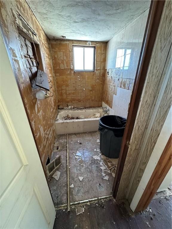 bathroom featuring a washtub