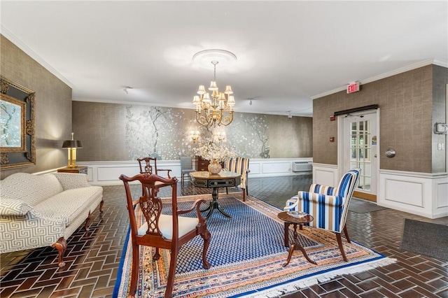 interior space with an AC wall unit, crown molding, and an inviting chandelier