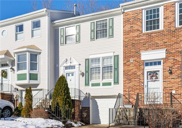 multi unit property featuring a garage