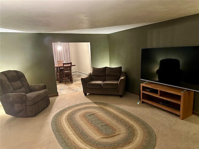 living room featuring light carpet and a baseboard heating unit