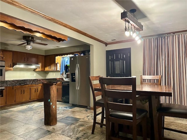 dining room featuring ceiling fan and crown molding