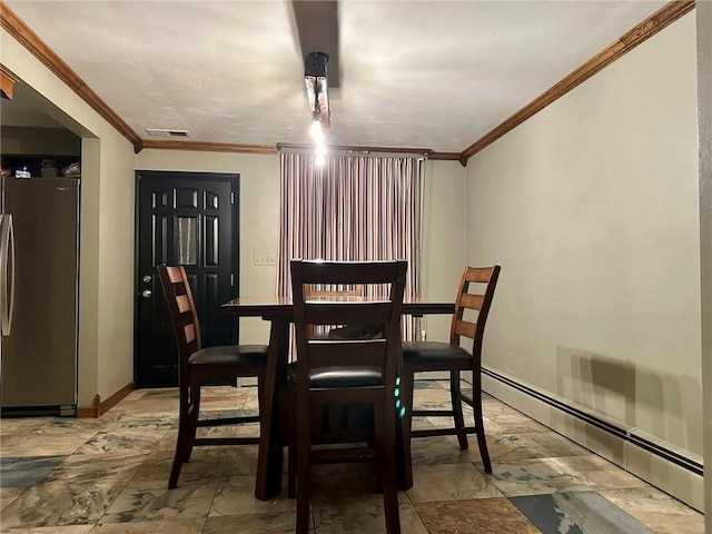 dining area featuring ornamental molding and a baseboard heating unit