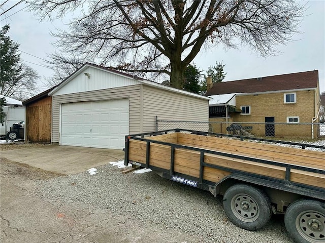 view of home's exterior with a garage and an outdoor structure