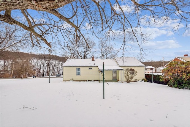 view of snow covered house