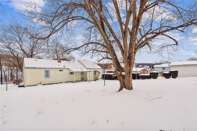 view of yard layered in snow